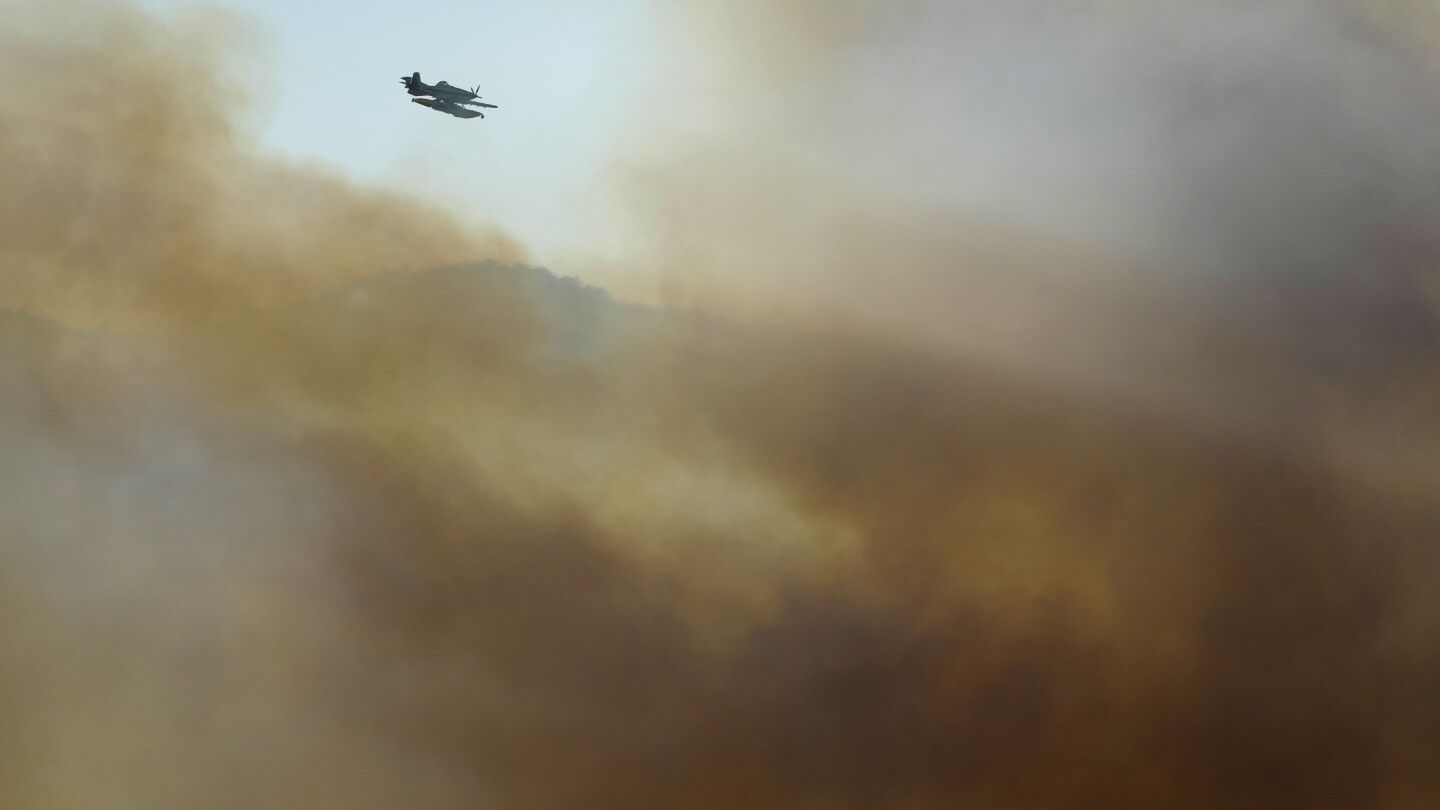 Deadly wildfires in Greece and other European countries destroy homes and threaten nature reserves