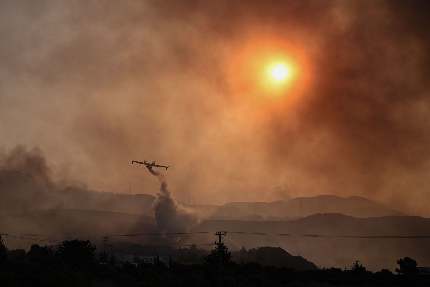 Two pilots killed in Greece plane crash as wildfires batter Sicily