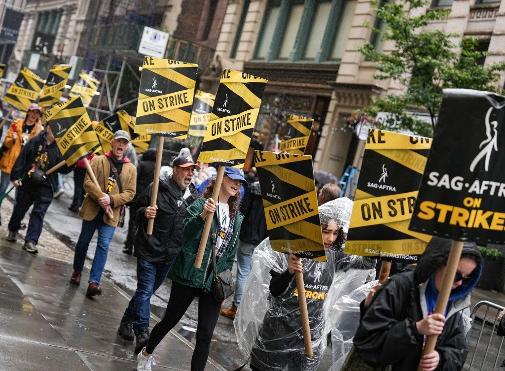 Actors Strike: SAG-AFTRA Picketers And Some From WGA, Brave The Rain In NYC