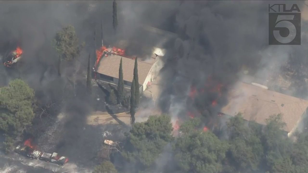 Brush fire destroys structures in Riverside County