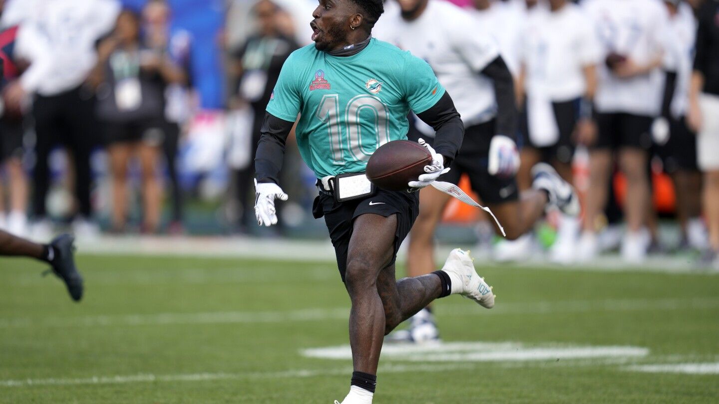 Social media influencer says Dolphins' Tyreek Hill broke her leg