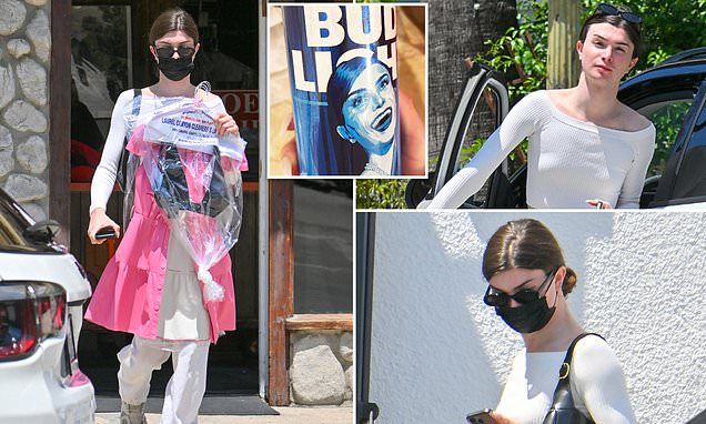 Dylan Mulvaney steps out to pick up a bikini top before heading to laser hair removal