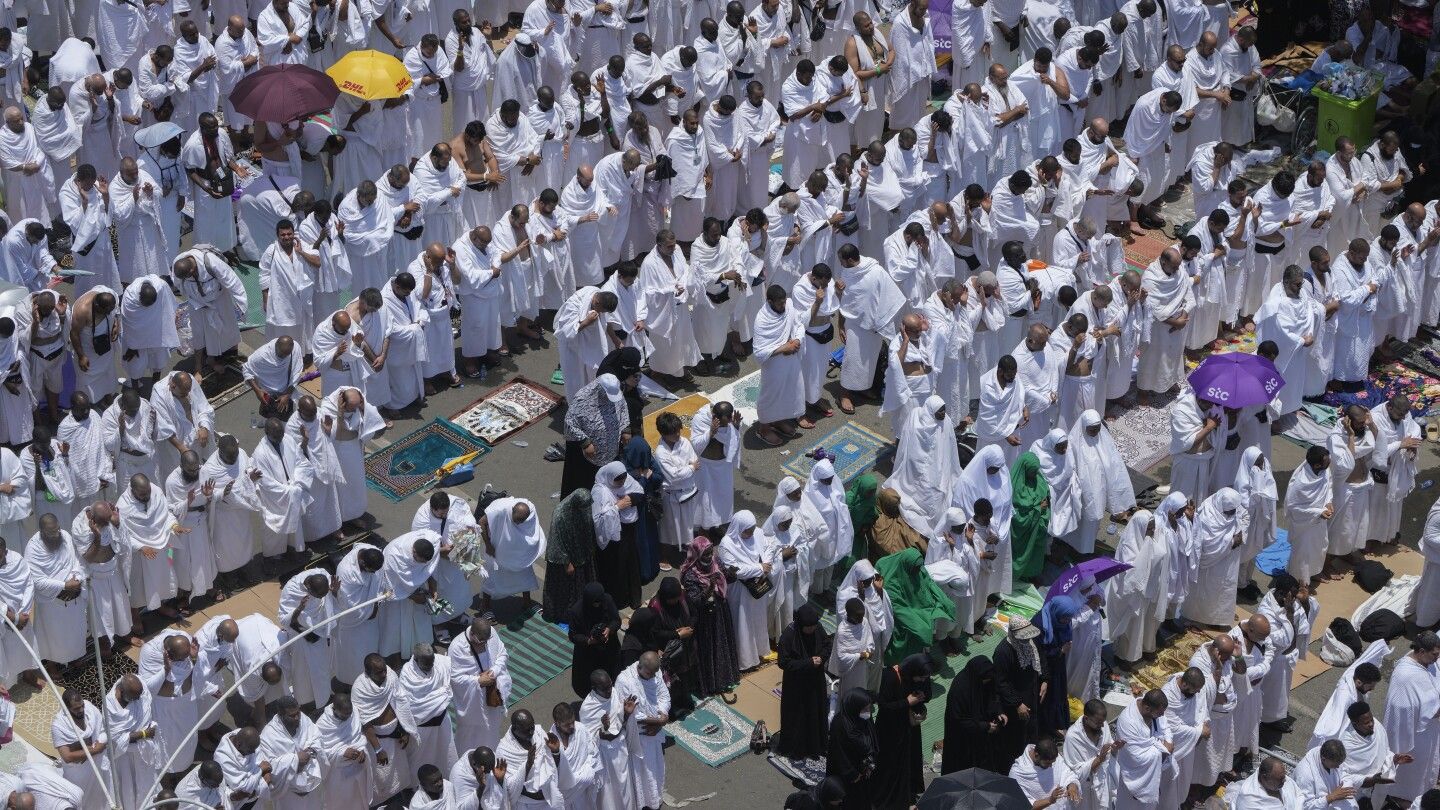 Muslims at Hajj pilgrimage brave intense heat to cast stones at pillars representing the devil