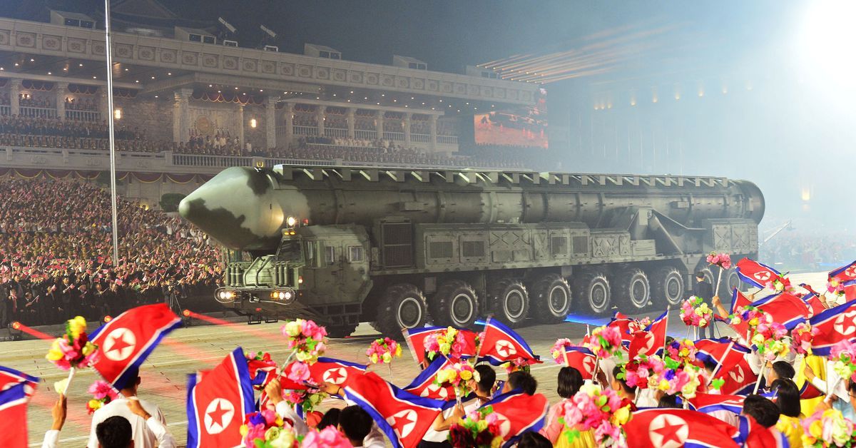 North Korea shows off ballistic missiles, drones at night-time parade