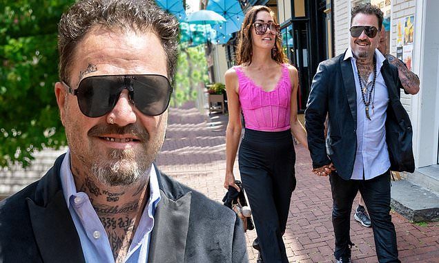 Jackass alum Bam Margera holds hands with fitness model Dannii Marie as he heads to court hearing in Pennsylvania stemming from row with brother