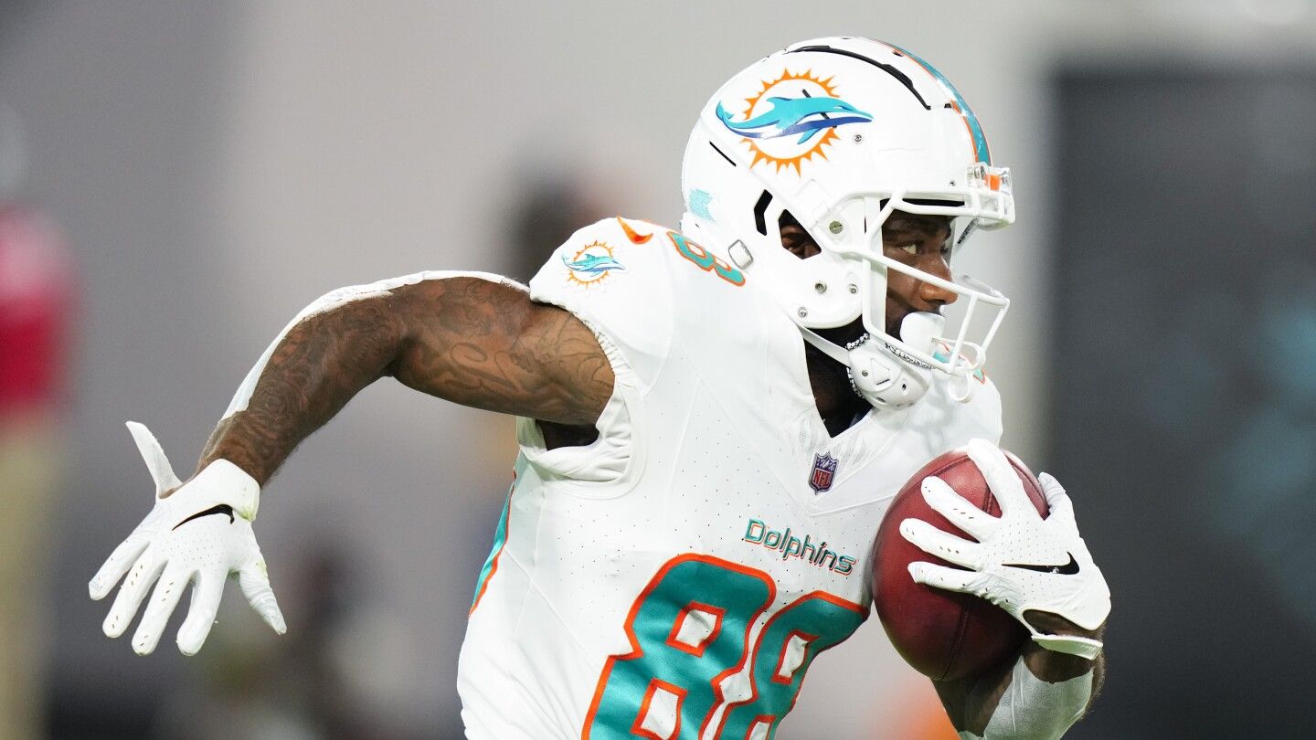 Dolphins reduce roster by 14 players