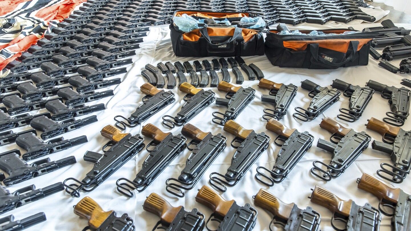 Austrian police seize drugs and vast trove of weapons in a raid on a far-right biker gang