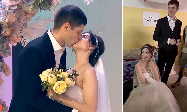 Ukrainian couple get married on live TV before fleeing to bomb shelter