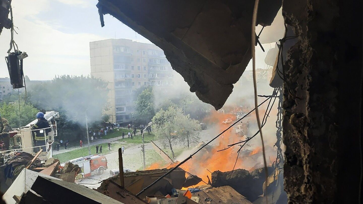 Russian missiles strike an apartment building, killing at least 4 in Ukrainian leader's hometown