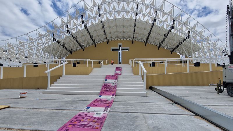 Pope Francis Portugal visit: Street artist Bordalo II rolls out ‘banknote’ carpet in protest