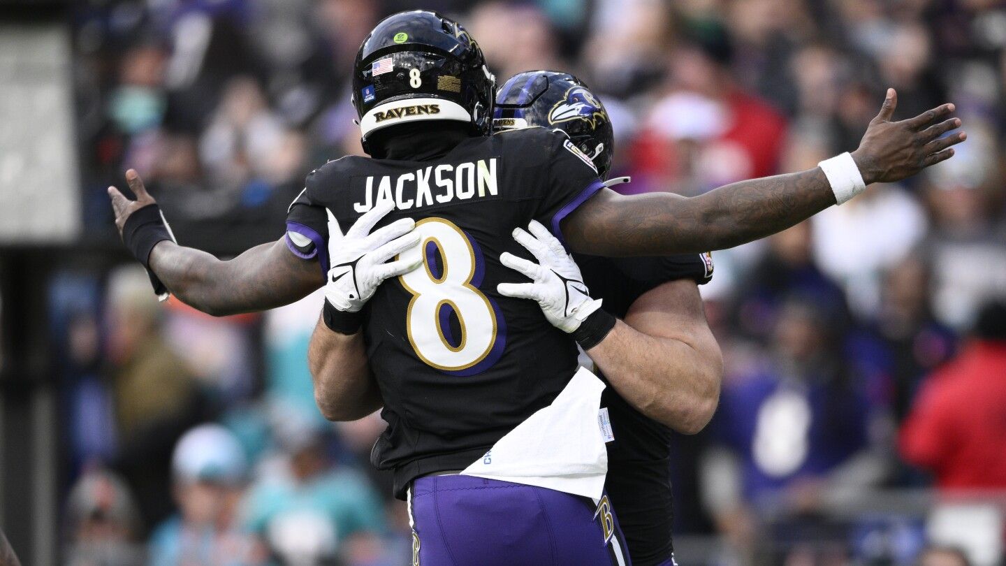 Lamar Jackson's perfect passer rating helps Ravens rout Dolphins 56-19 to clinch top seed in AFC